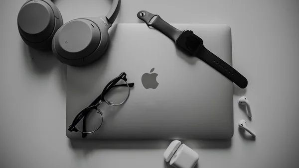 a black and white photo of a microphone and headphones