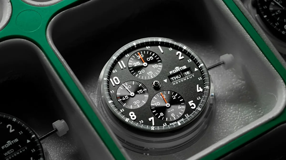 a close up of a watch in a box