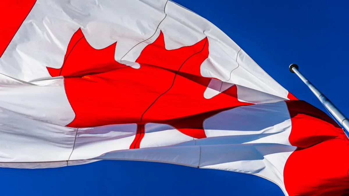 white and red flag under blue sky during daytime