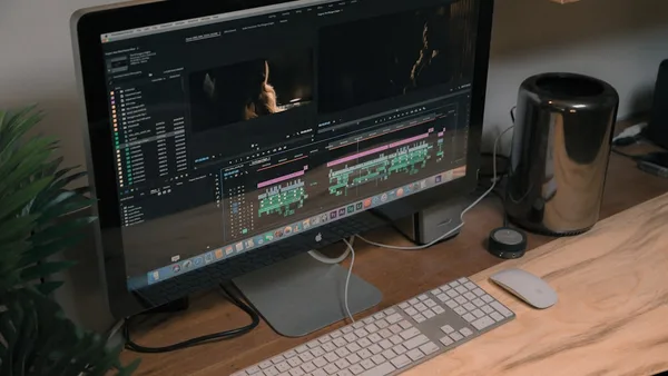 Apple iMac and Apple Magic Mouse and Keyboard on table