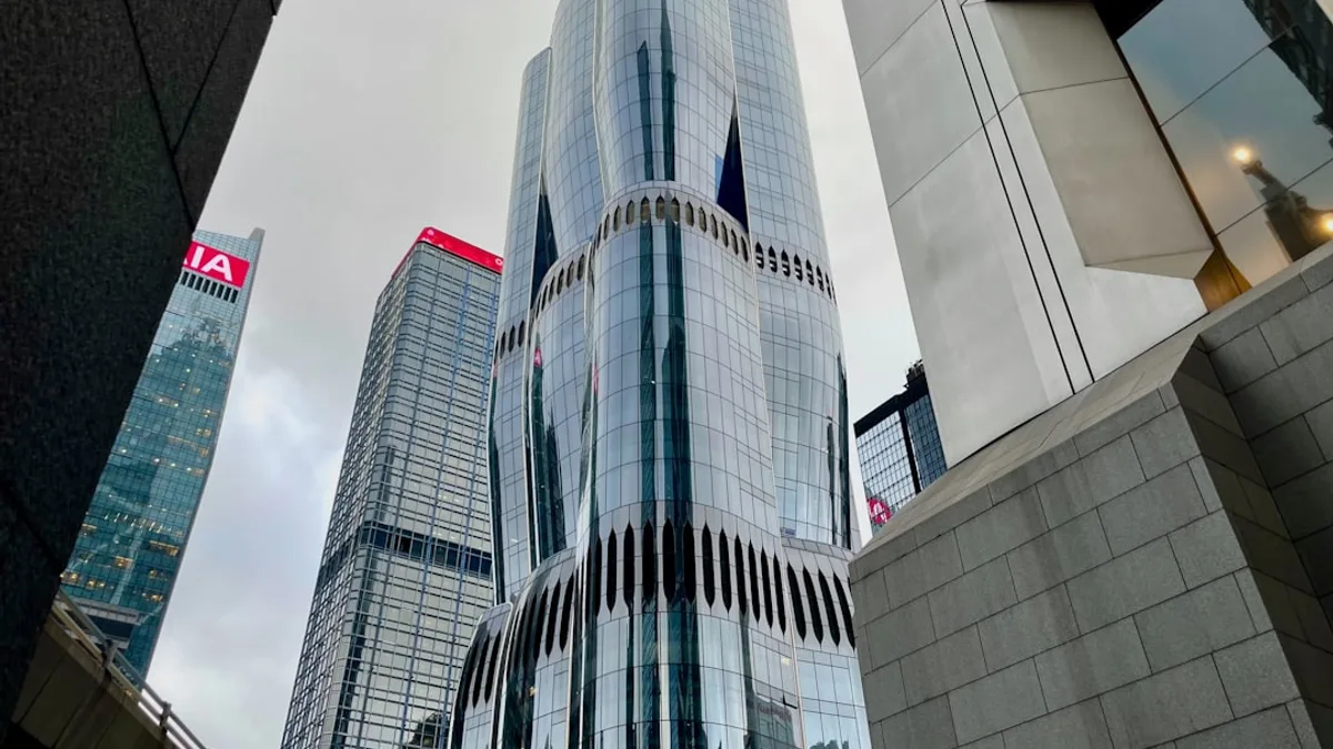 Modern skyscrapers in a city under cloudy sky