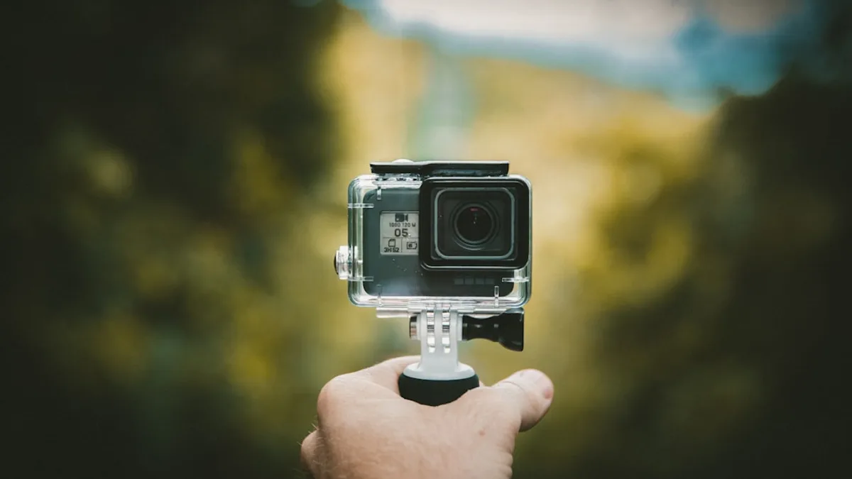 person holding action camera
