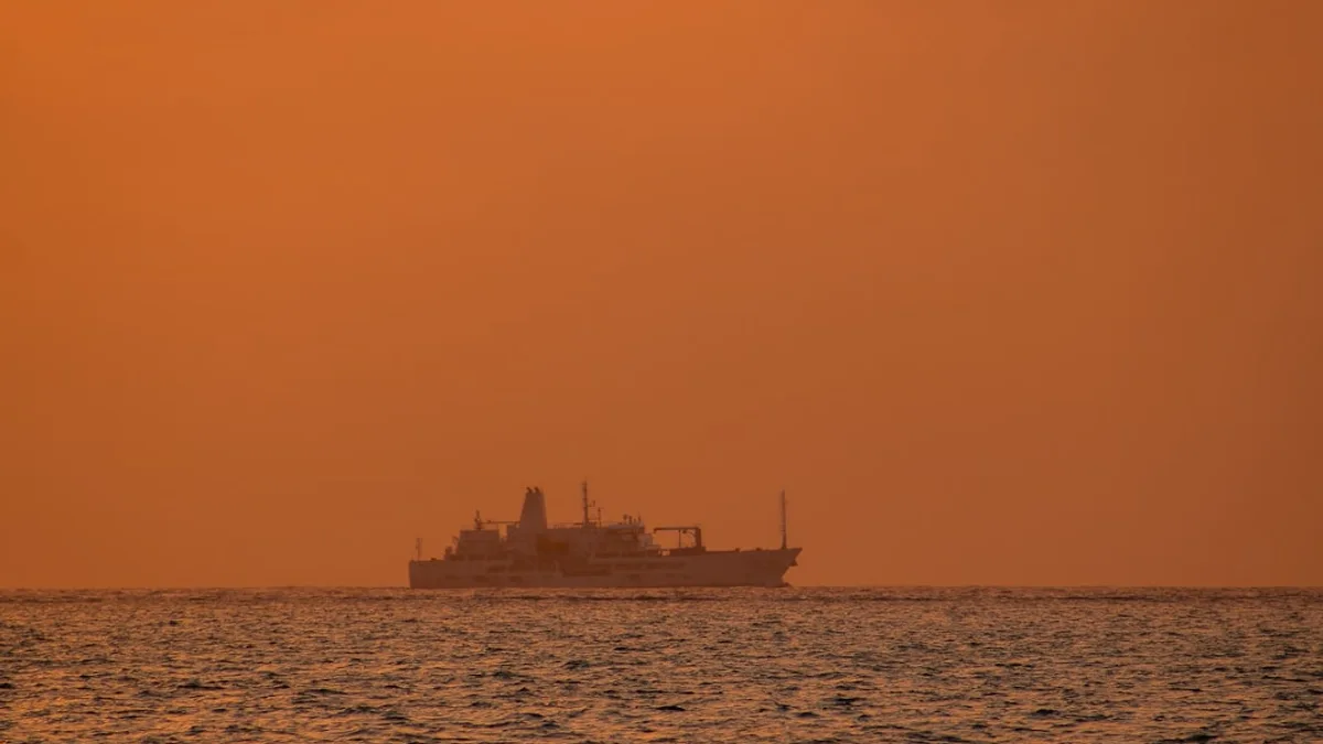 a large boat floating on top of a large body of water