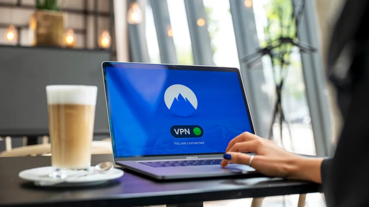 person using black laptop computer