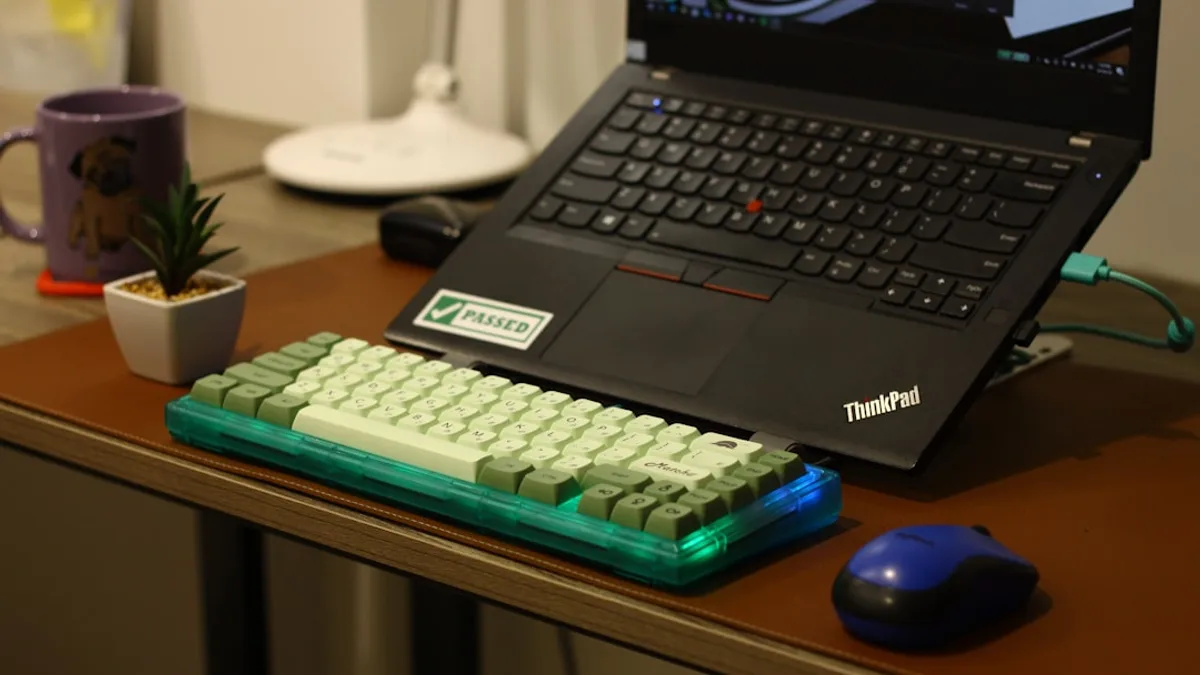 A laptop with a mechanical keyboard and mouse.