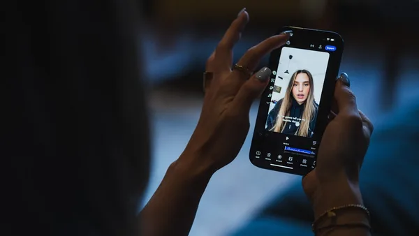 Person watching video on smartphone screen of smartphone