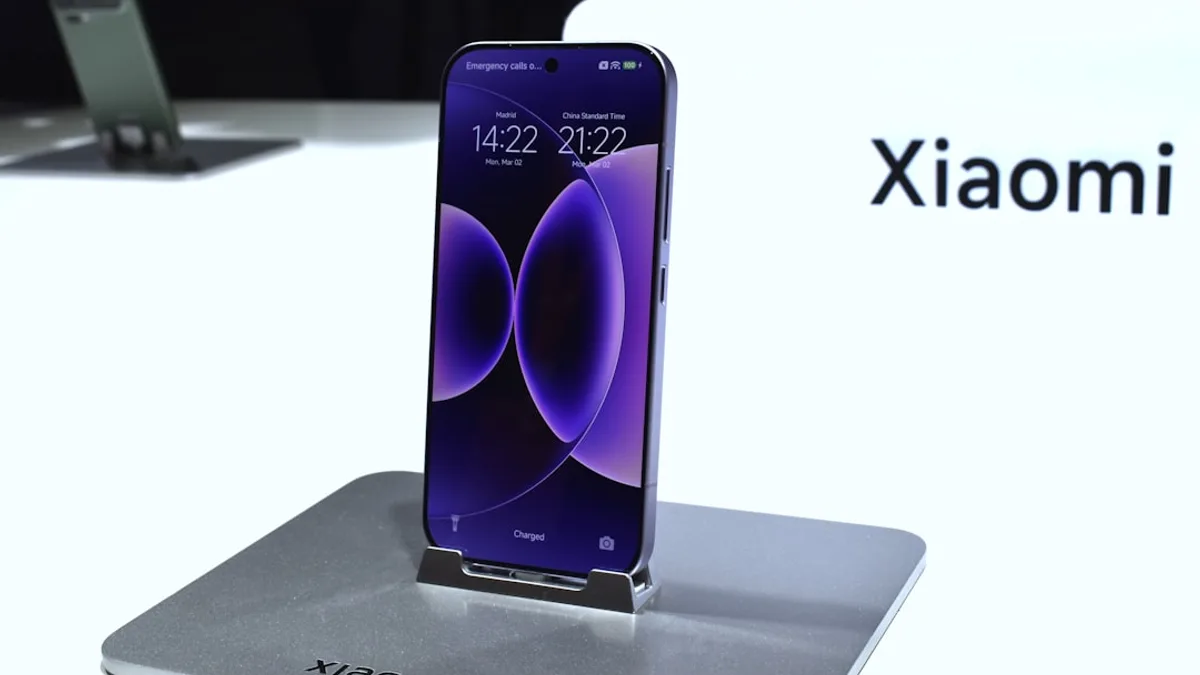 A purple xiaomi smartphone displayed on a stand.