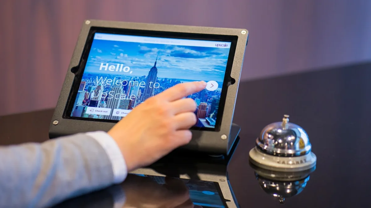 person about to touch black Android tablet computer