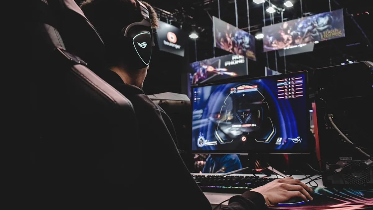 person sitting on gaming chair while playing video game