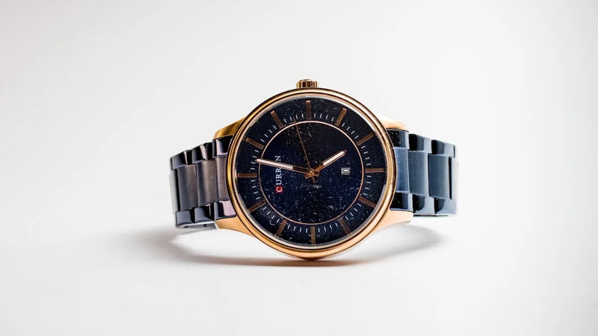 silver and gold round analog watch