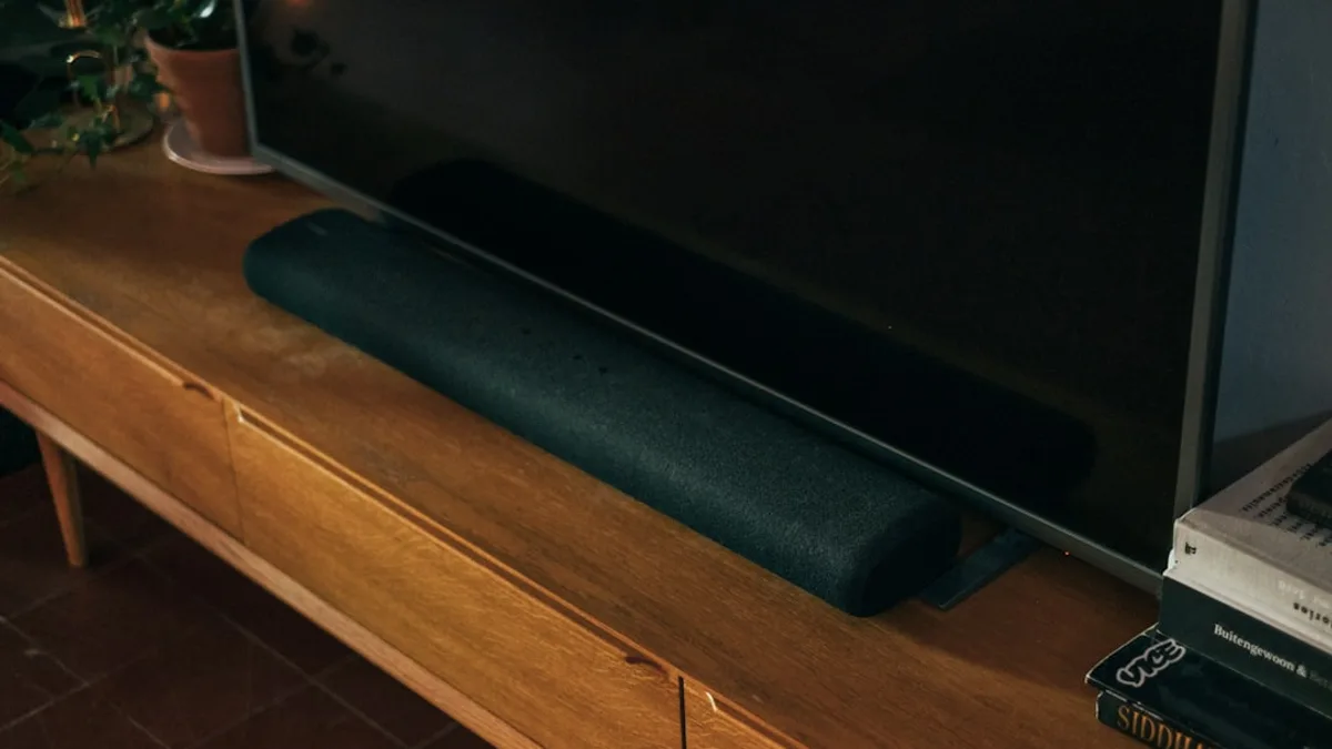 black flat screen tv on brown wooden table
