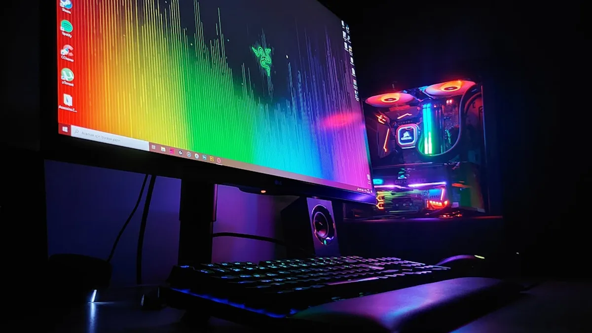 black flat screen computer monitor turned on beside black computer keyboard
