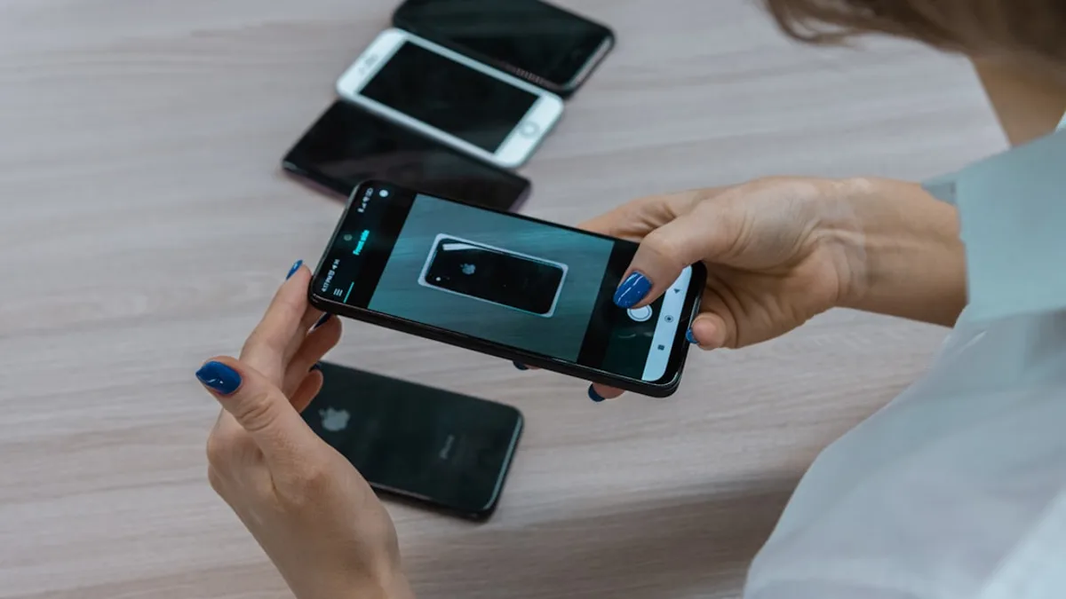 a woman holding a smart phone in her hands