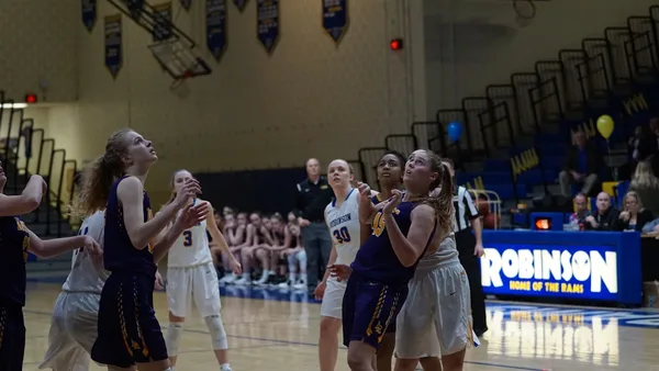 female basketball players playing on robinson court