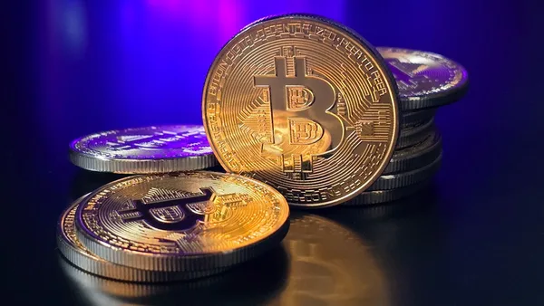 a pile of bitcoins sitting on top of a table