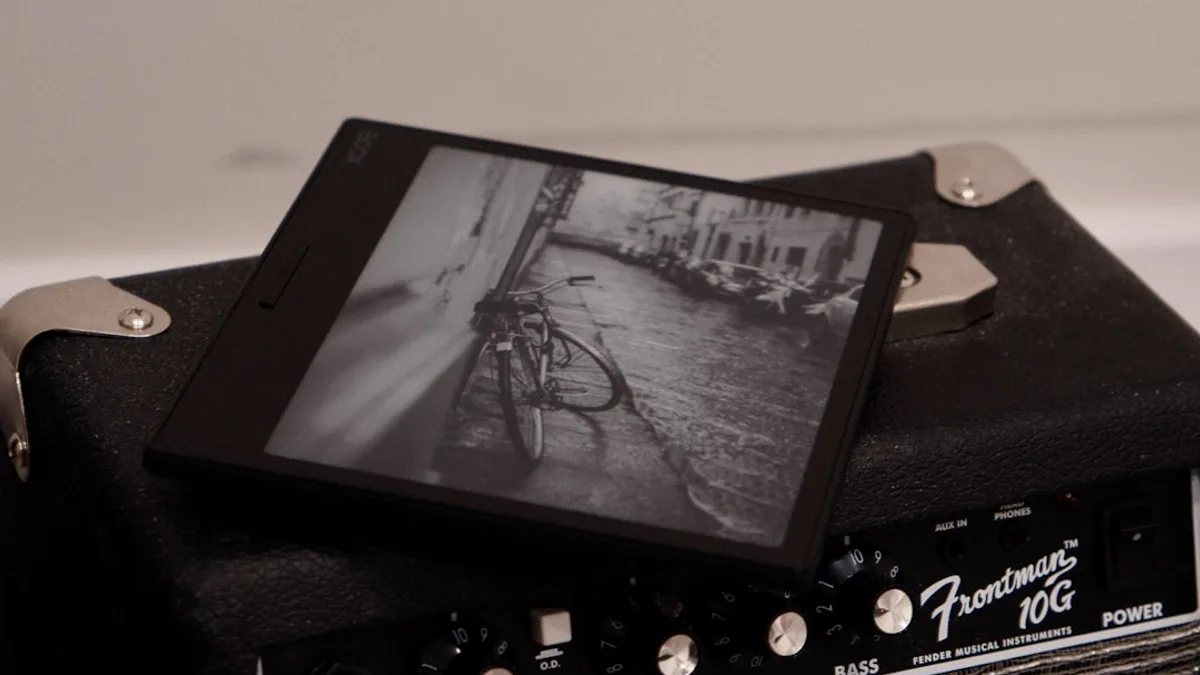 A tablet shows a bicycle on an amplifier.