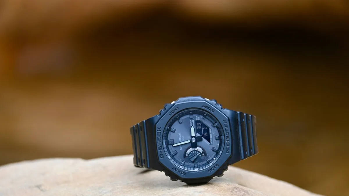 a watch sitting on top of a rock