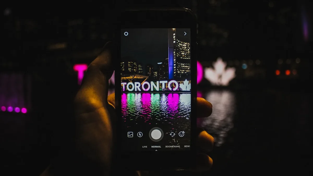 A person holding a cell phone in their hand