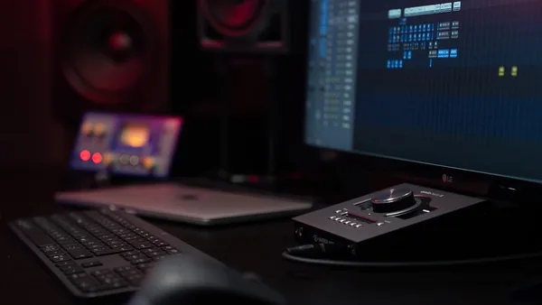 black remote control beside black computer keyboard