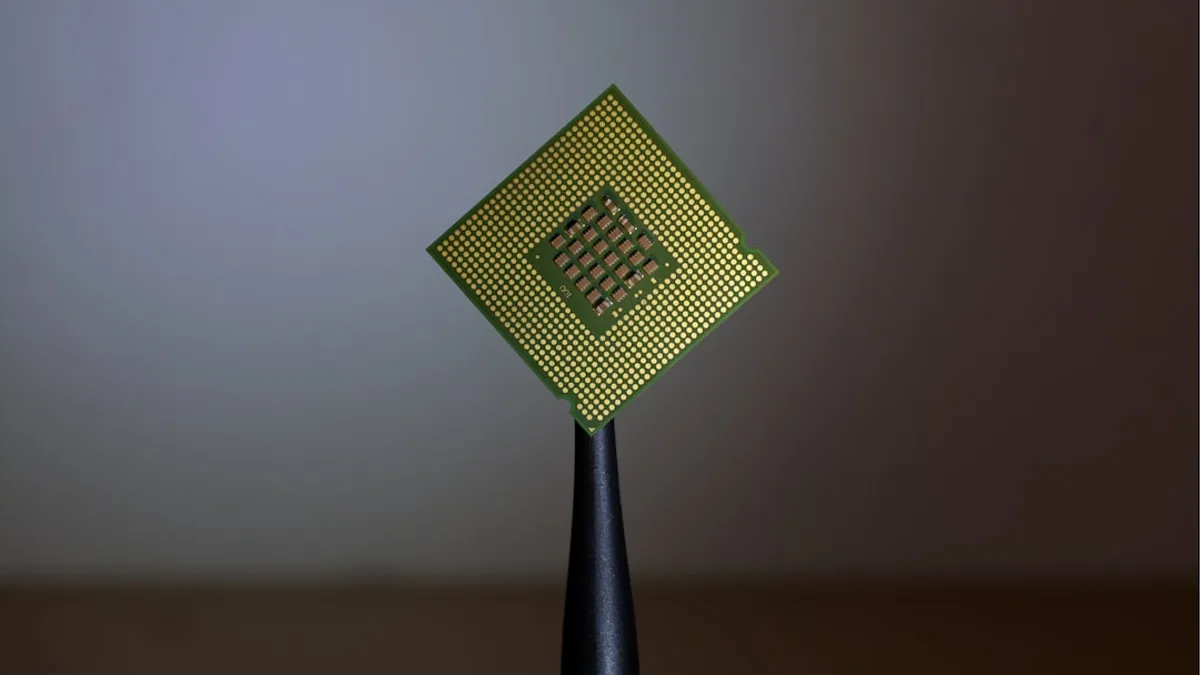 person holding computer cell processor
