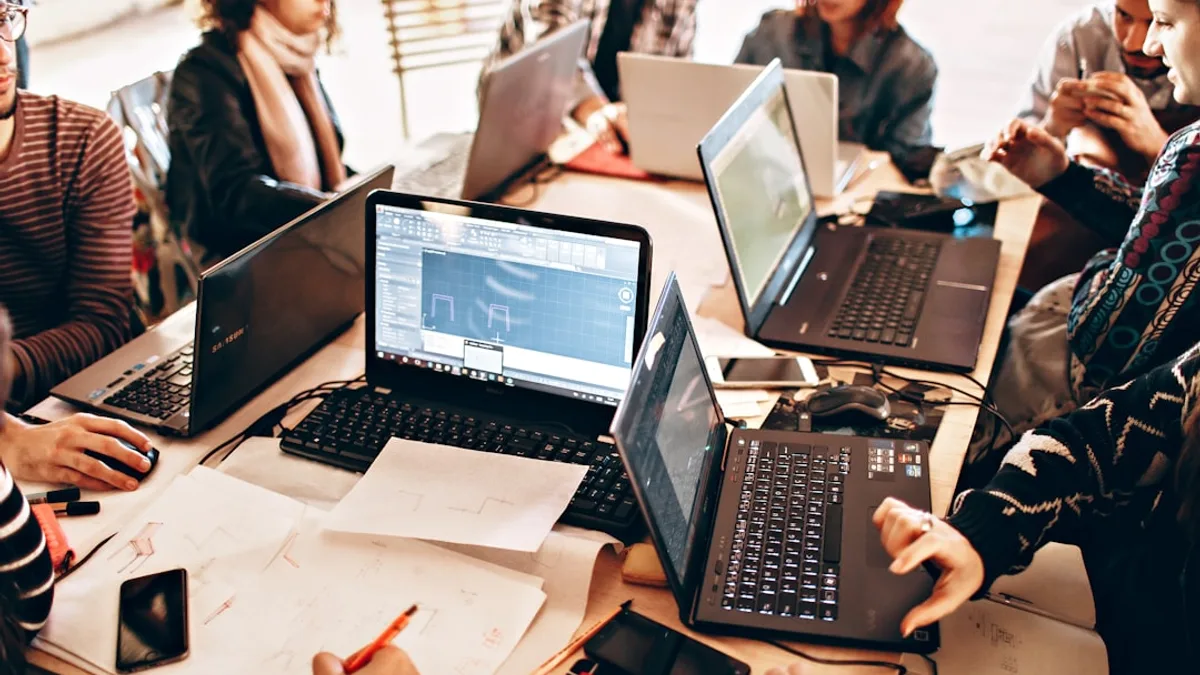 person using black laptop computer