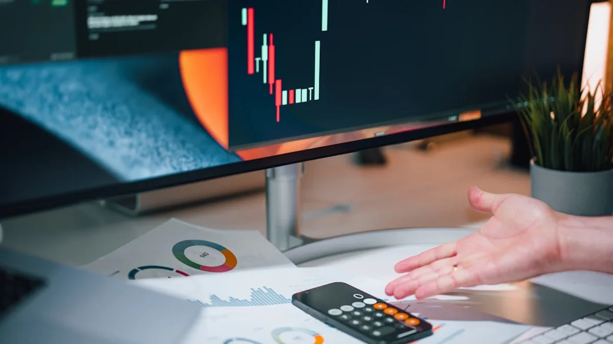 a person pointing at a calculator on a desk