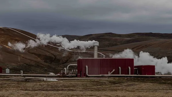 a red building with steam coming out of it
