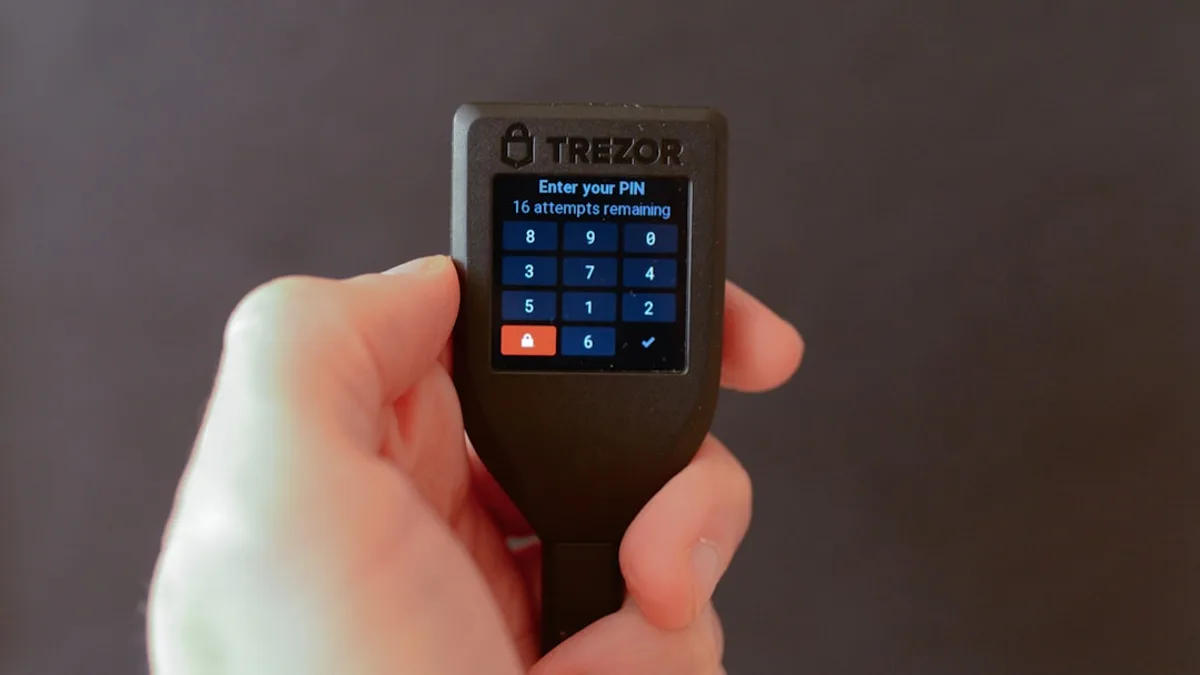 a person holding a cell phone in their hand