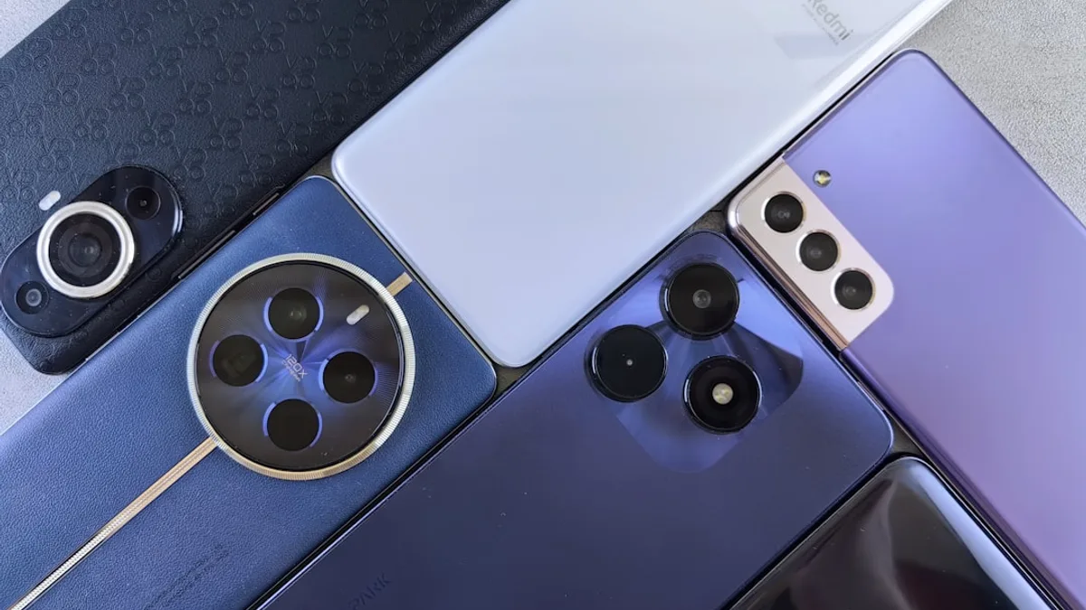 A bunch of cell phones sitting next to each other