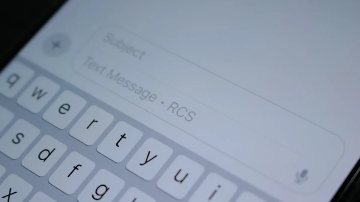 A close up of a cell phone with a keyboard