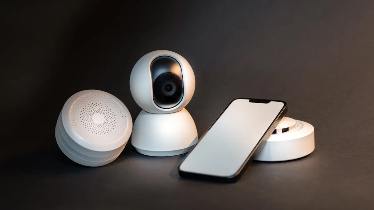 a smart phone sitting next to a wireless security camera