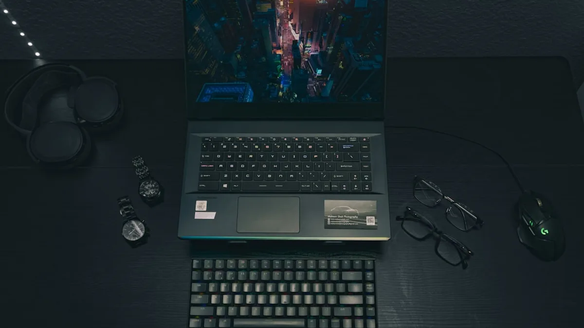 a laptop computer sitting on top of a wooden desk