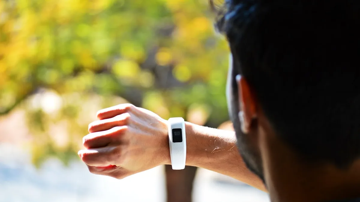 man looking at activity tracker