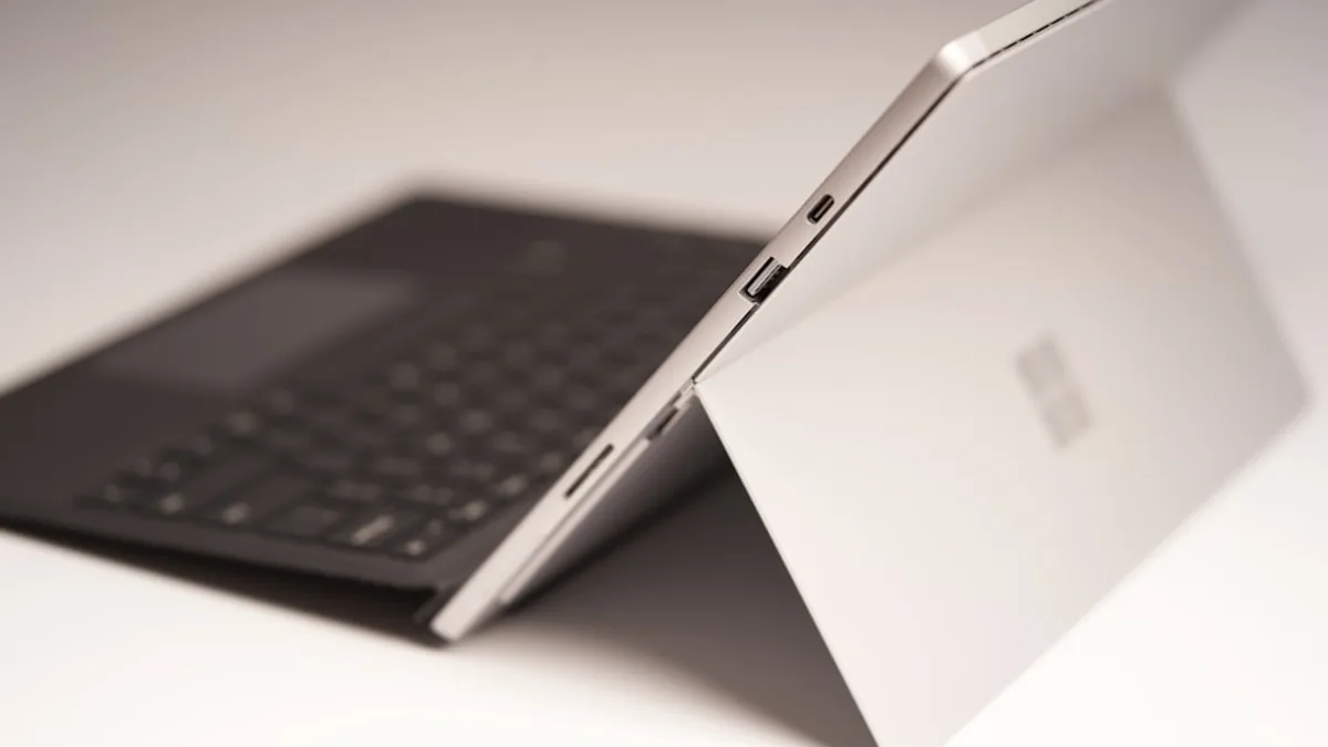 black ipad with keyboard on white table