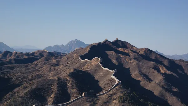 brown mountain under blue sky