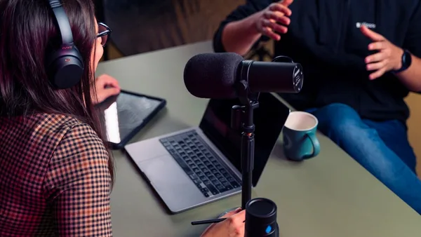 a person with headphones on using a laptop