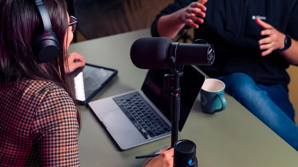a person with headphones on using a laptop