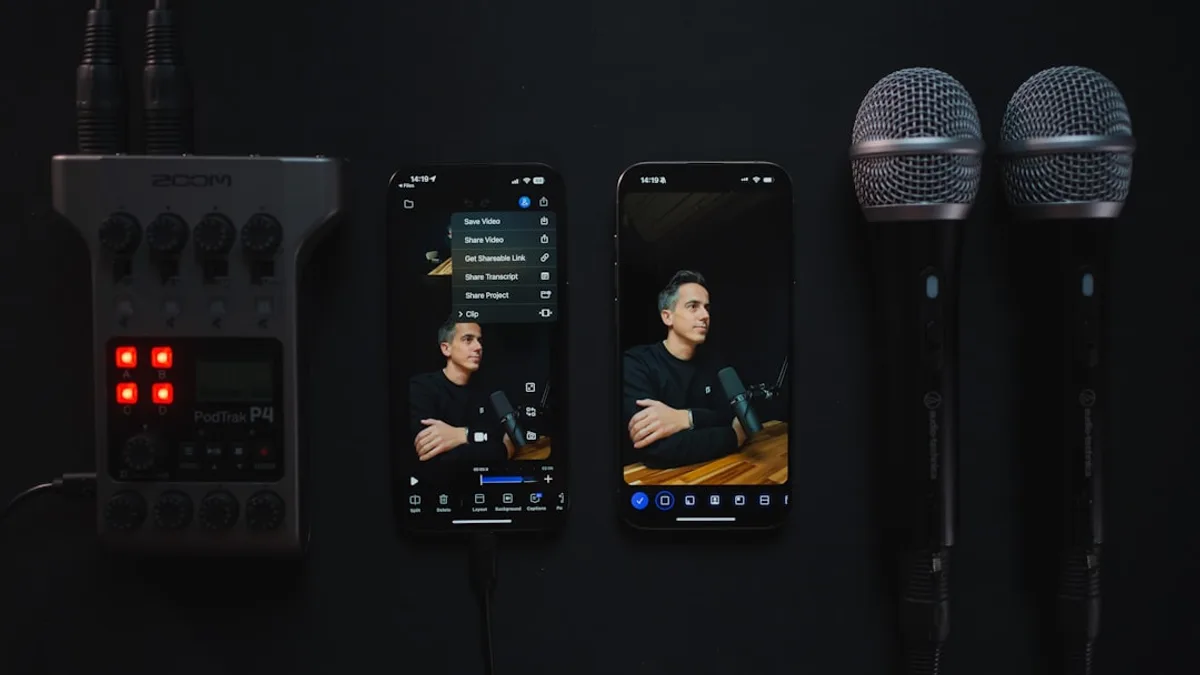 Audio recorder, phones, and microphones on dark surface