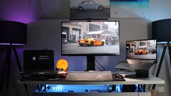 black laptop computer on white desk