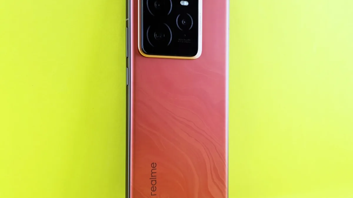 Red smartphone with camera array on yellow background