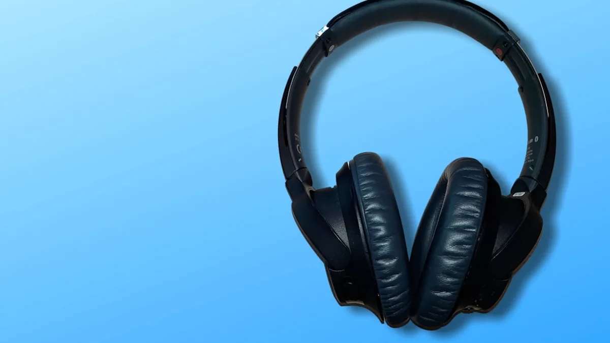 black and white headphones on white table