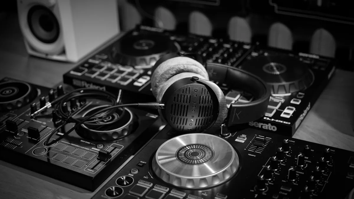 a pair of headphones sitting on top of a dj's decks