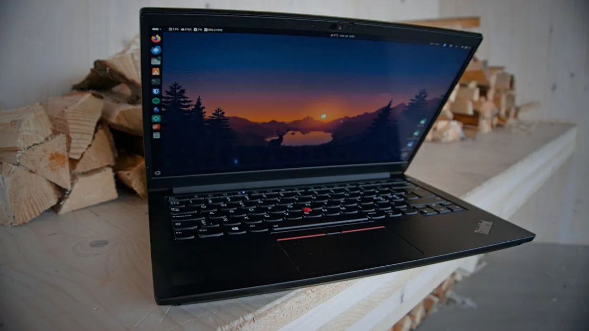 A laptop displaying a beautiful sunset.