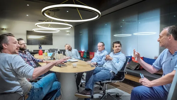 group of people sitting on chair