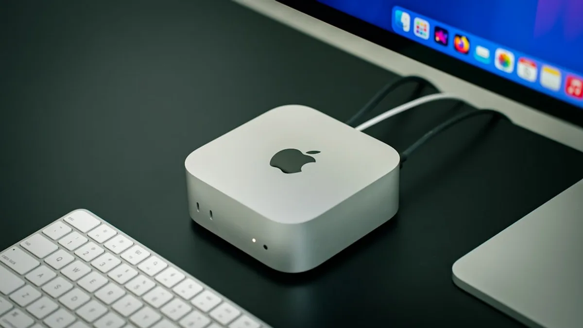 An apple computer with a keyboard and mouse