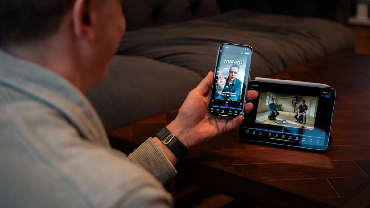 Man holding phone watching video on screen.
