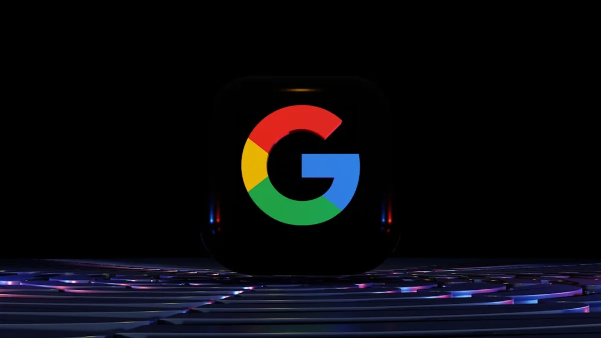 a close up of a computer keyboard with the google logo on it