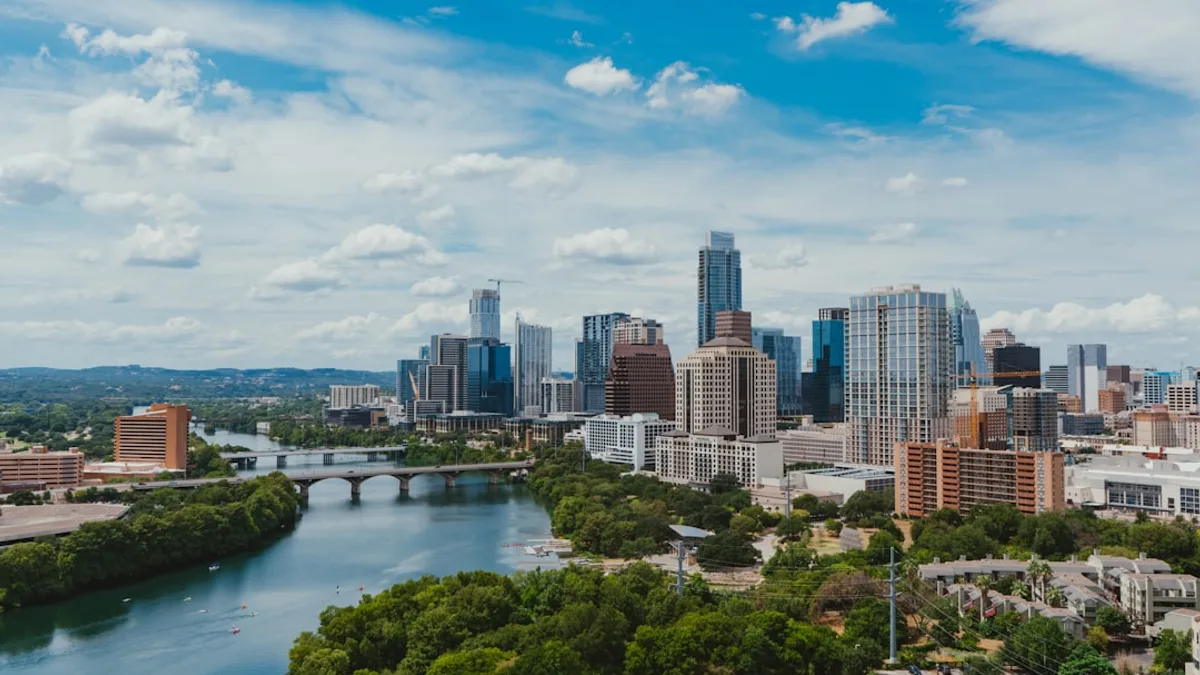 river near buildings during daytime