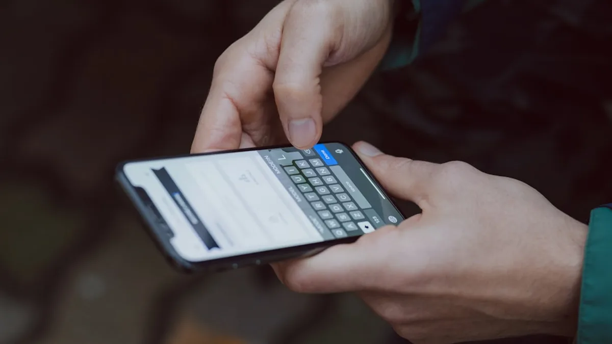 selective focus photography of person using smartphone