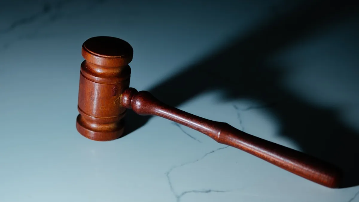 a wooden judge's hammer sitting on top of a table